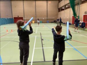 2 children throwing foam javelins