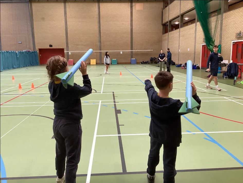 2 children throwing foam javelins