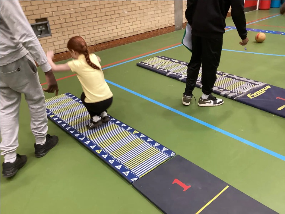 A child doing a long jump